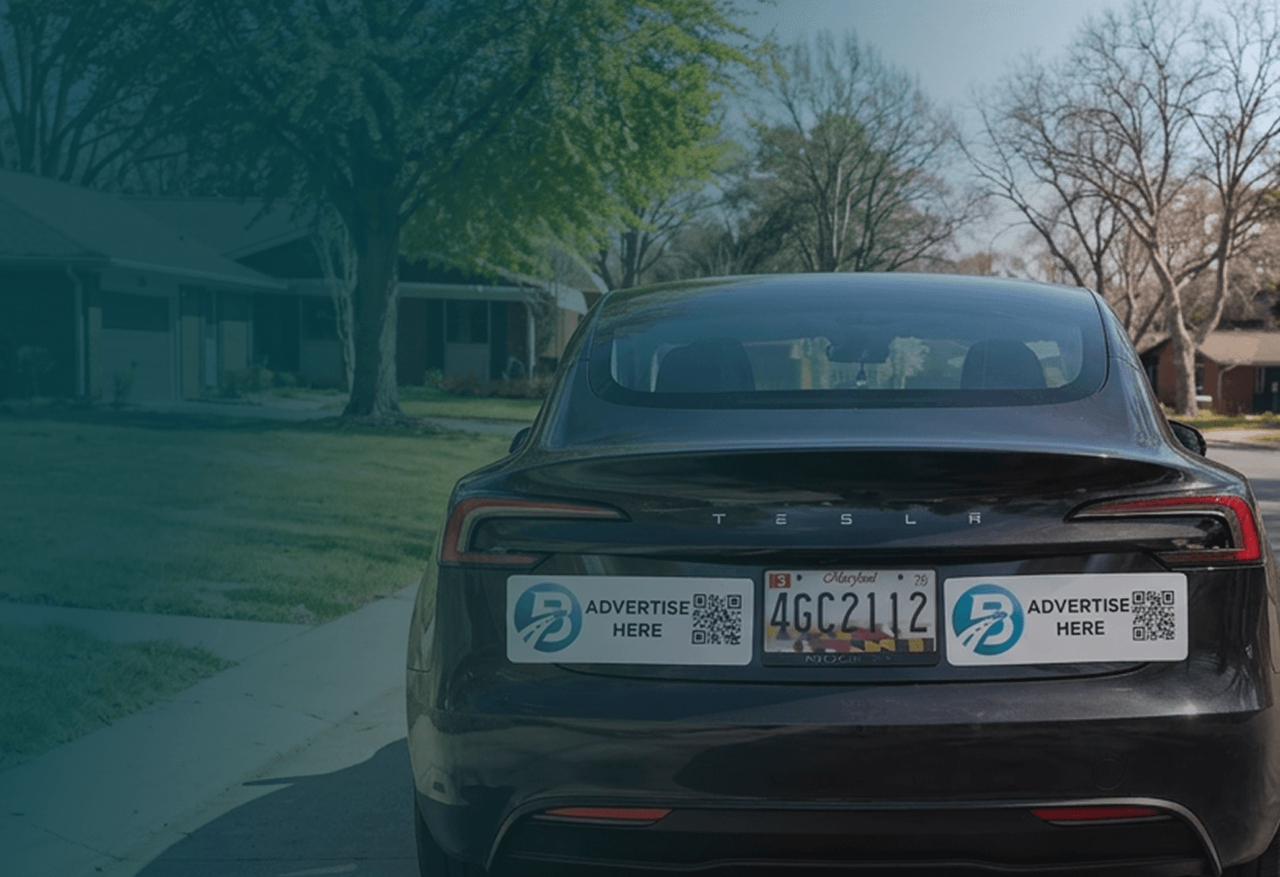 Rear view of a vehicle with BrandDrive LLC bumper advertising